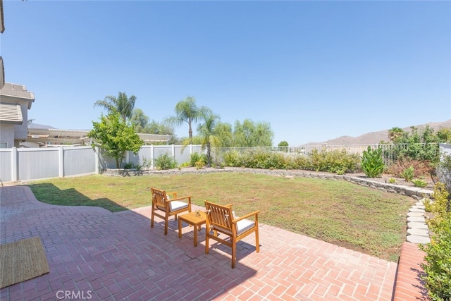 view of patio / terrace with a mountain view