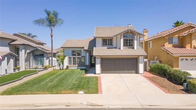 view of front of home featuring a front yard and a garage