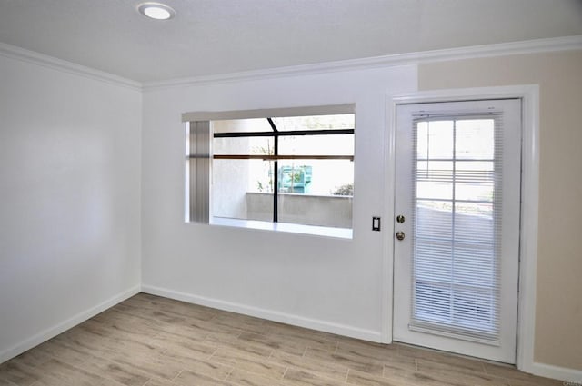 doorway featuring light hardwood / wood-style floors and crown molding