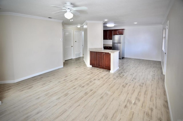 kitchen featuring ceiling fan, light hardwood / wood-style flooring, crown molding, and stainless steel refrigerator