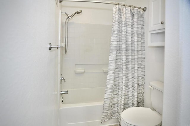 bathroom featuring toilet and shower / bath combo