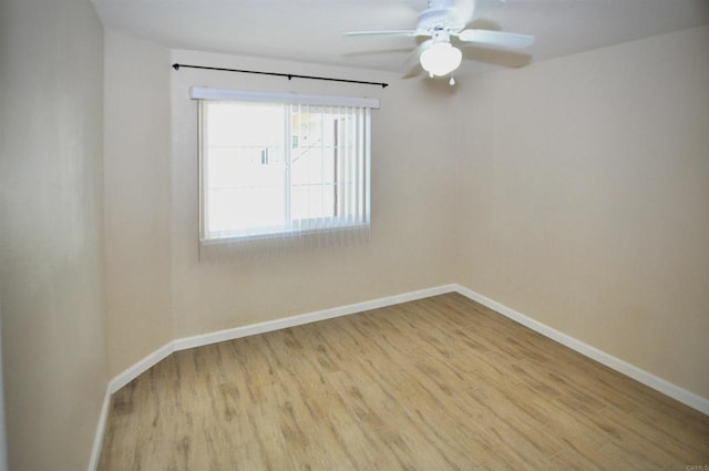 spare room with light hardwood / wood-style flooring and ceiling fan