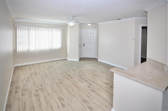 unfurnished living room featuring ceiling fan, ornamental molding, and light hardwood / wood-style floors