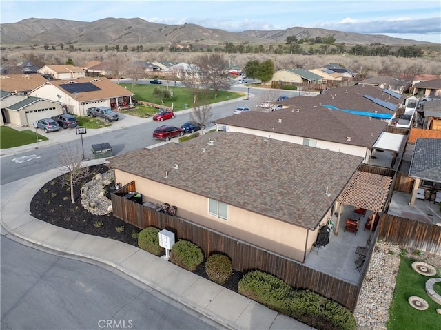 birds eye view of property featuring a mountain view