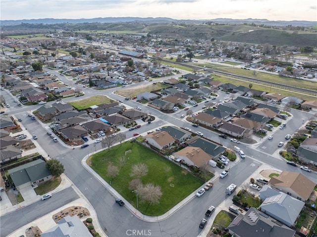 birds eye view of property featuring a mountain view