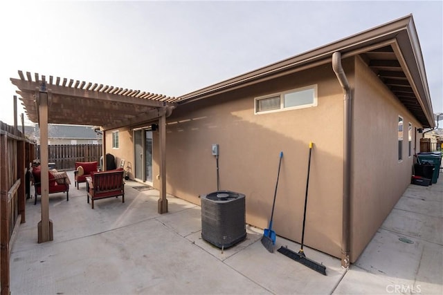 view of patio / terrace featuring central air condition unit, a pergola, and outdoor lounge area