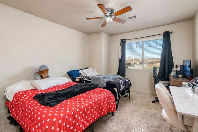 bedroom with ceiling fan and light colored carpet