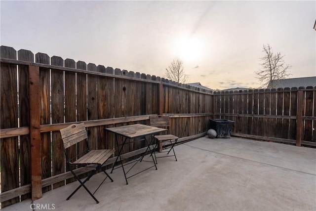 view of patio terrace at dusk