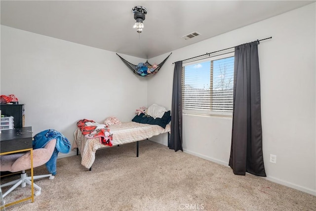 bedroom with light colored carpet