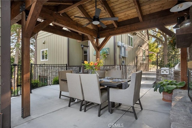 view of patio with an outdoor kitchen, a gazebo, and ceiling fan