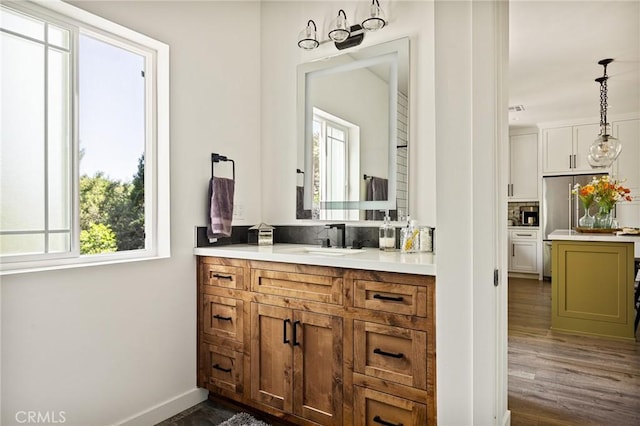 bathroom with hardwood / wood-style floors, backsplash, and vanity