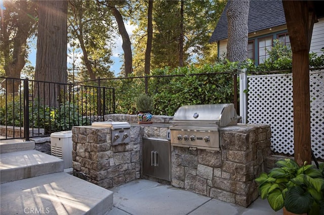 view of patio featuring a grill and exterior kitchen