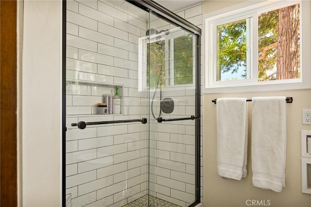 bathroom featuring an enclosed shower