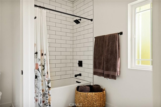 bathroom featuring shower / bath combination with curtain