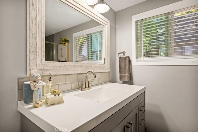 bathroom featuring decorative backsplash and vanity