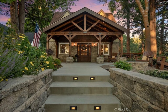 view of exterior entry at dusk