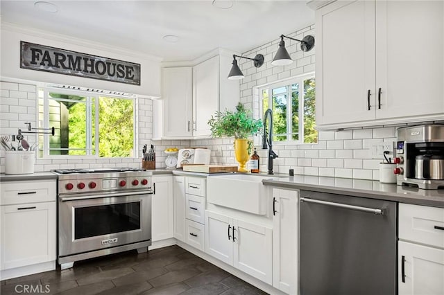 kitchen with white cabinetry, sink, and stainless steel appliances