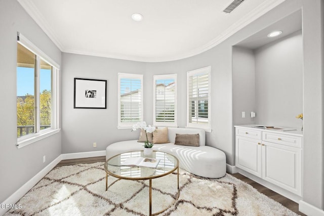 living area with dark wood-type flooring and crown molding