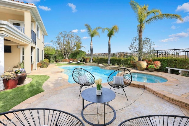 view of swimming pool with a patio