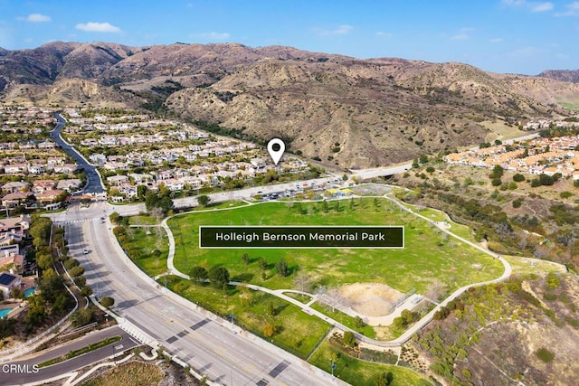 birds eye view of property featuring a mountain view