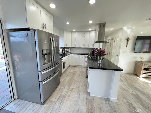 kitchen featuring island exhaust hood, stainless steel refrigerator with ice dispenser, dark countertops, white cabinets, and light wood-type flooring