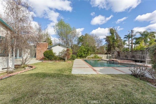 view of pool featuring a patio and a lawn