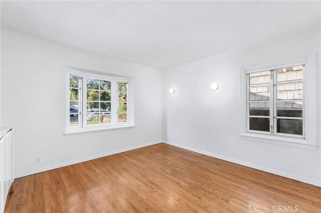 unfurnished room featuring light hardwood / wood-style floors