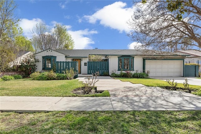 ranch-style home featuring a garage and a front yard