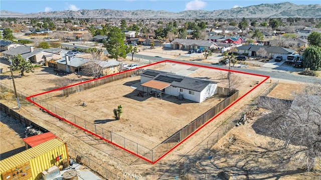 drone / aerial view featuring a residential view and a mountain view