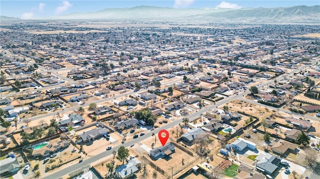 bird's eye view with a residential view and a mountain view