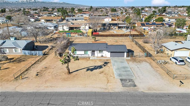 birds eye view of property with a residential view and a mountain view