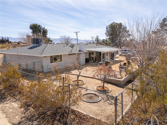 back of house with a patio and central AC unit