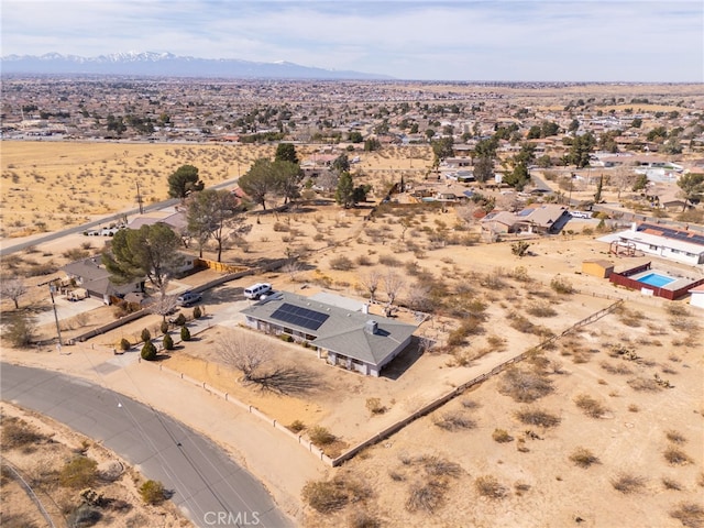 drone / aerial view featuring a mountain view