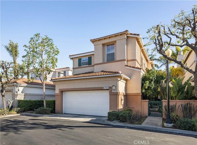 mediterranean / spanish-style home featuring a garage