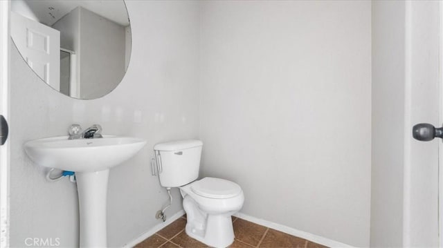 bathroom featuring tile patterned floors and toilet