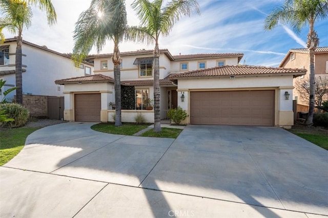 mediterranean / spanish-style house featuring a garage