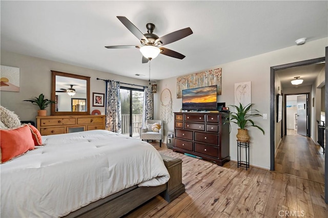 30451 San Pasqual Rd, Temecula, CA 92591 - bedroom with light wood-style flooring, a ceiling fan, and baseboards