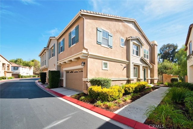 view of property exterior with a garage