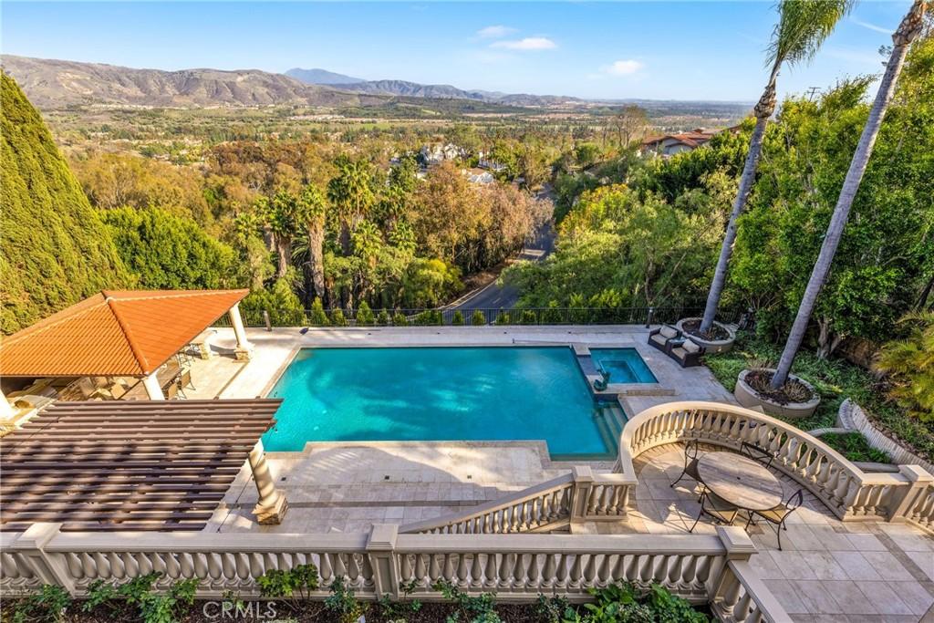 11332 Vista Del Lago, North Tustin, CA 92705 - view of pool featuring fence, a pool with connected hot tub, a mountain view, and a patio