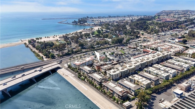 aerial view with a water view and a beach view