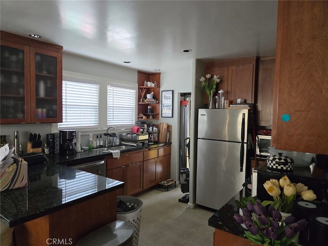 2833 Best Ave, Oakland, CA 94619 - kitchen featuring dark stone counters, sink, stainless steel appliances, and kitchen peninsula