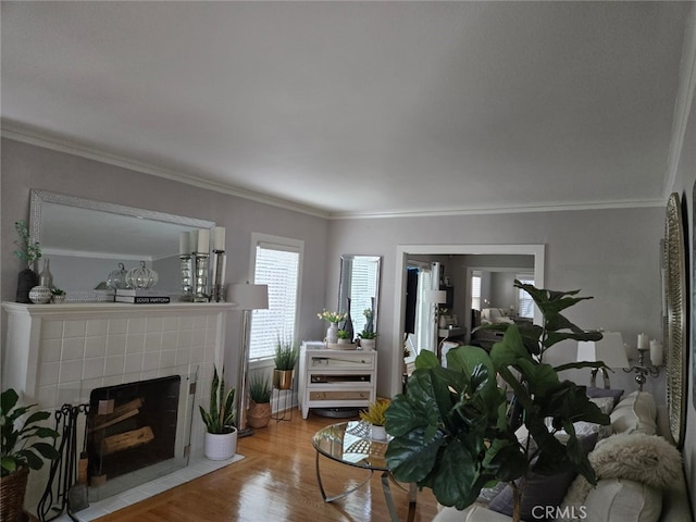 2833 Best Ave, Oakland, CA 94619 - living room featuring a tile fireplace, crown molding, and wood-type flooring