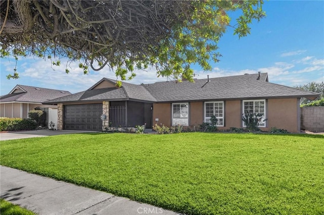 single story home with a front lawn and a garage