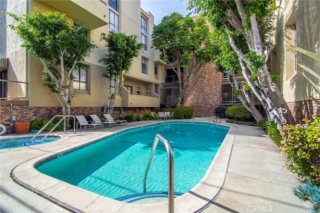 view of swimming pool with a patio