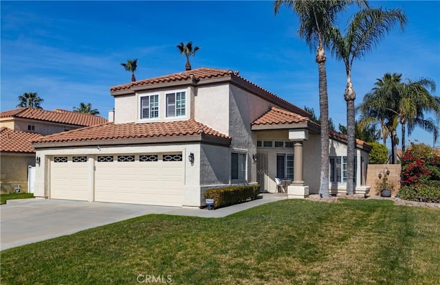 mediterranean / spanish home with a garage, driveway, a tile roof, a front lawn, and stucco siding