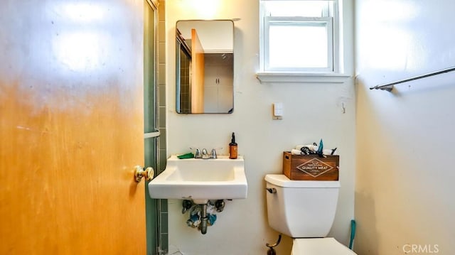 bathroom featuring a sink and toilet