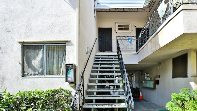 view of exterior entry with stucco siding