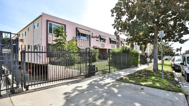 view of property featuring a residential view and fence