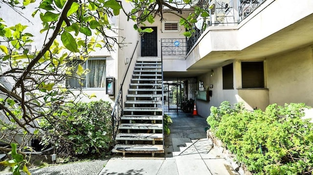 view of exterior entry with stucco siding