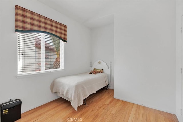 bedroom featuring wood-type flooring